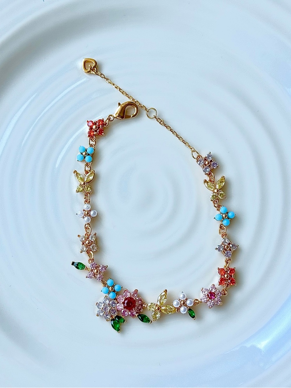Vibrant Floral & Butterfly Crystal Bracelet | CZ Gold-Tone Charm